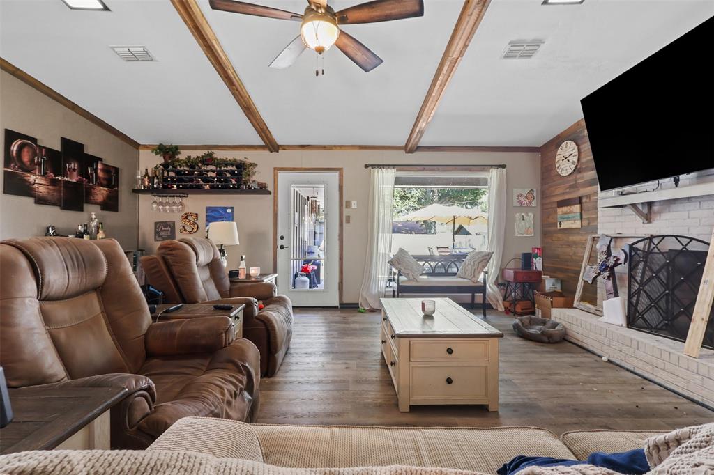 124 Lou Street Sulphur Springs, TX 75482 - Photo 5 of 33 a living room with furniture and a flat screen tv