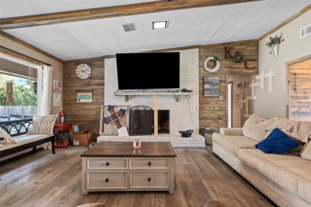 124 Lou Street Sulphur Springs, TX 75482 - Photo 7 of 33 a living room with furniture and a flat screen tv