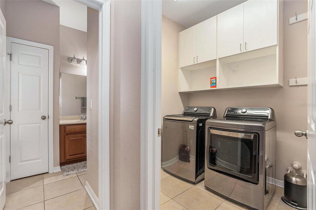 10737 Breaking Rocks Drive Tampa, FL 33647 - Photo 13 of 28 a view of a kitchen with washer and dryer