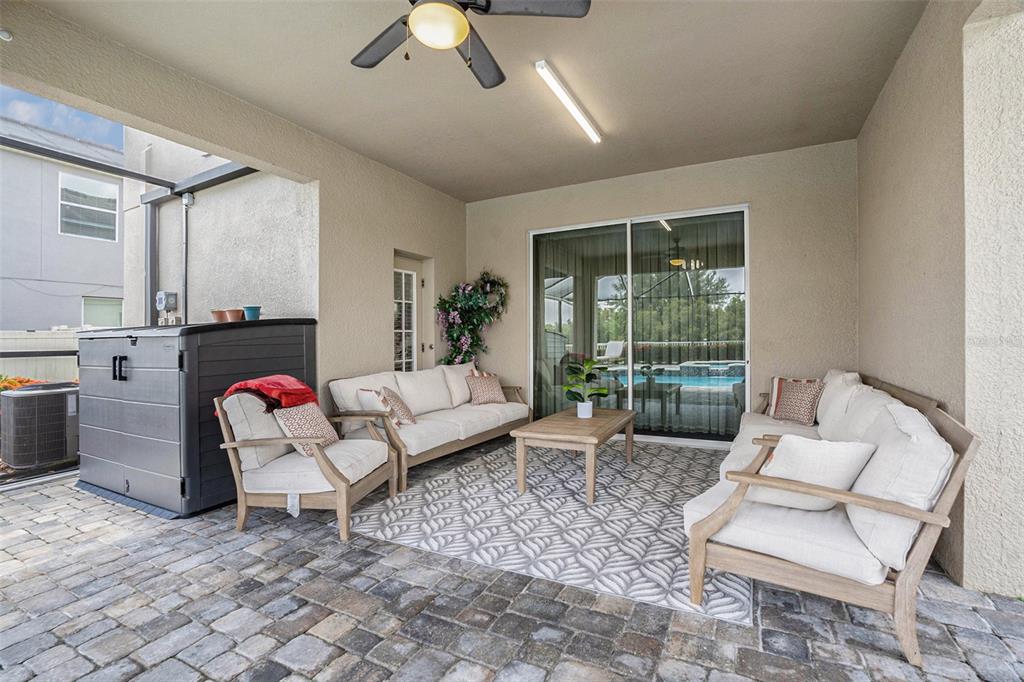 10737 Breaking Rocks Drive Tampa, FL 33647 - Photo 24 of 28 a living room with furniture and a large window