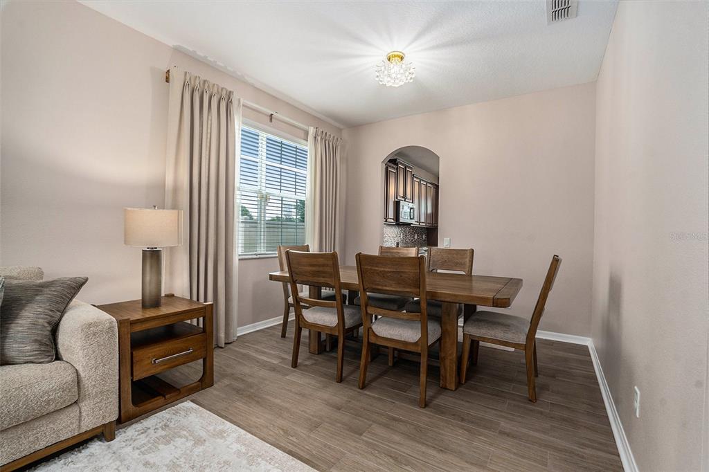10737 Breaking Rocks Drive Tampa, FL 33647 - Photo 6 of 28 a view of a dining room with furniture and a window
