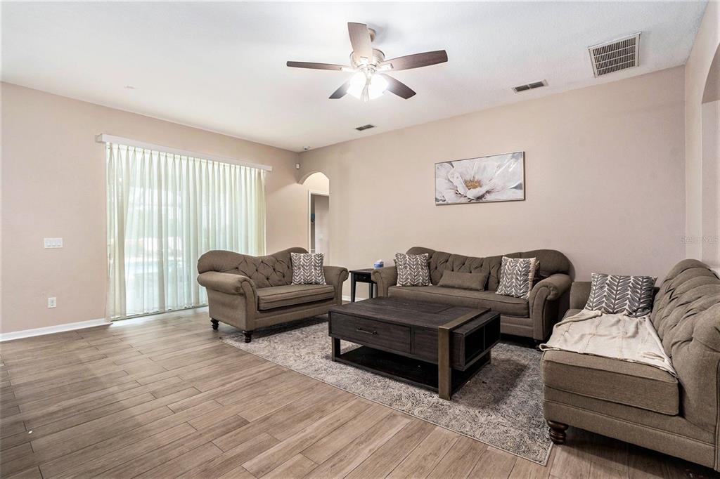 10737 Breaking Rocks Drive Tampa, FL 33647 - Photo 7 of 28 a living room with furniture and a large window