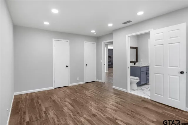 a view of hallway with wooden floor