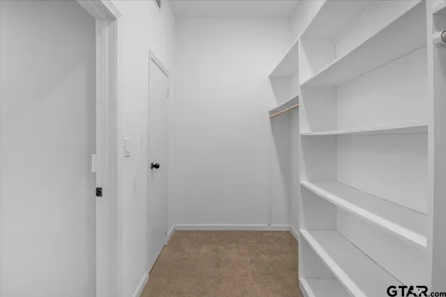 a view of an empty walk in closet