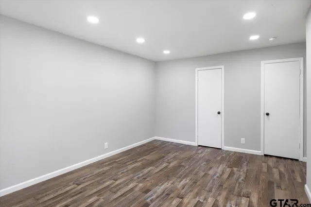 a view of room with wooden floor