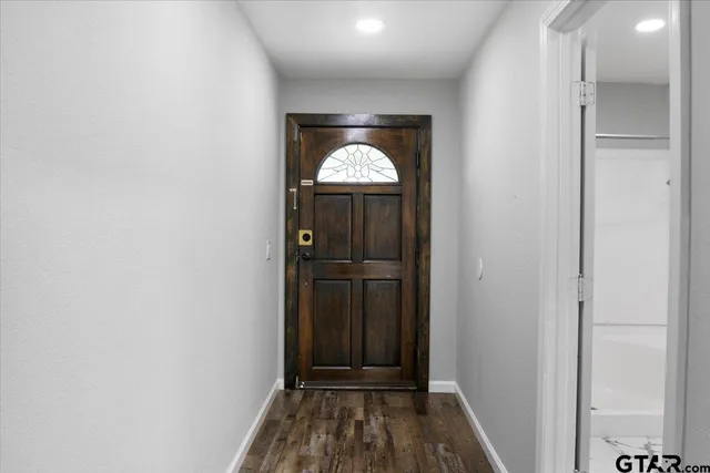 a view of an entryway with a door
