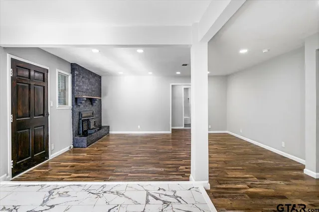 a view of a refrigerator in kitchen and wooden floor