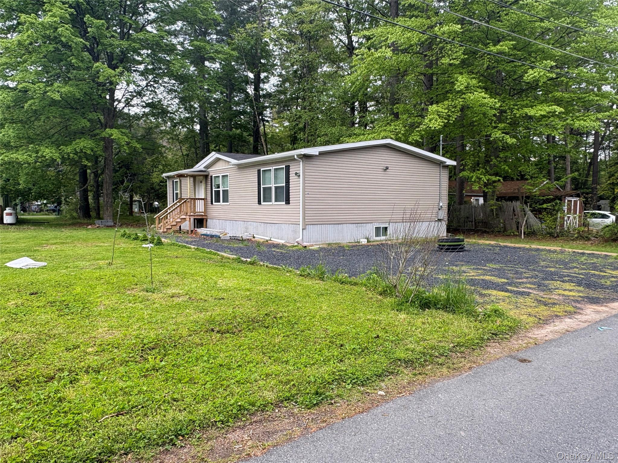 40 4th Street Godeffroy, NY 12729 - Photo 1 of 17 Side exterior view showing spacious yard area.