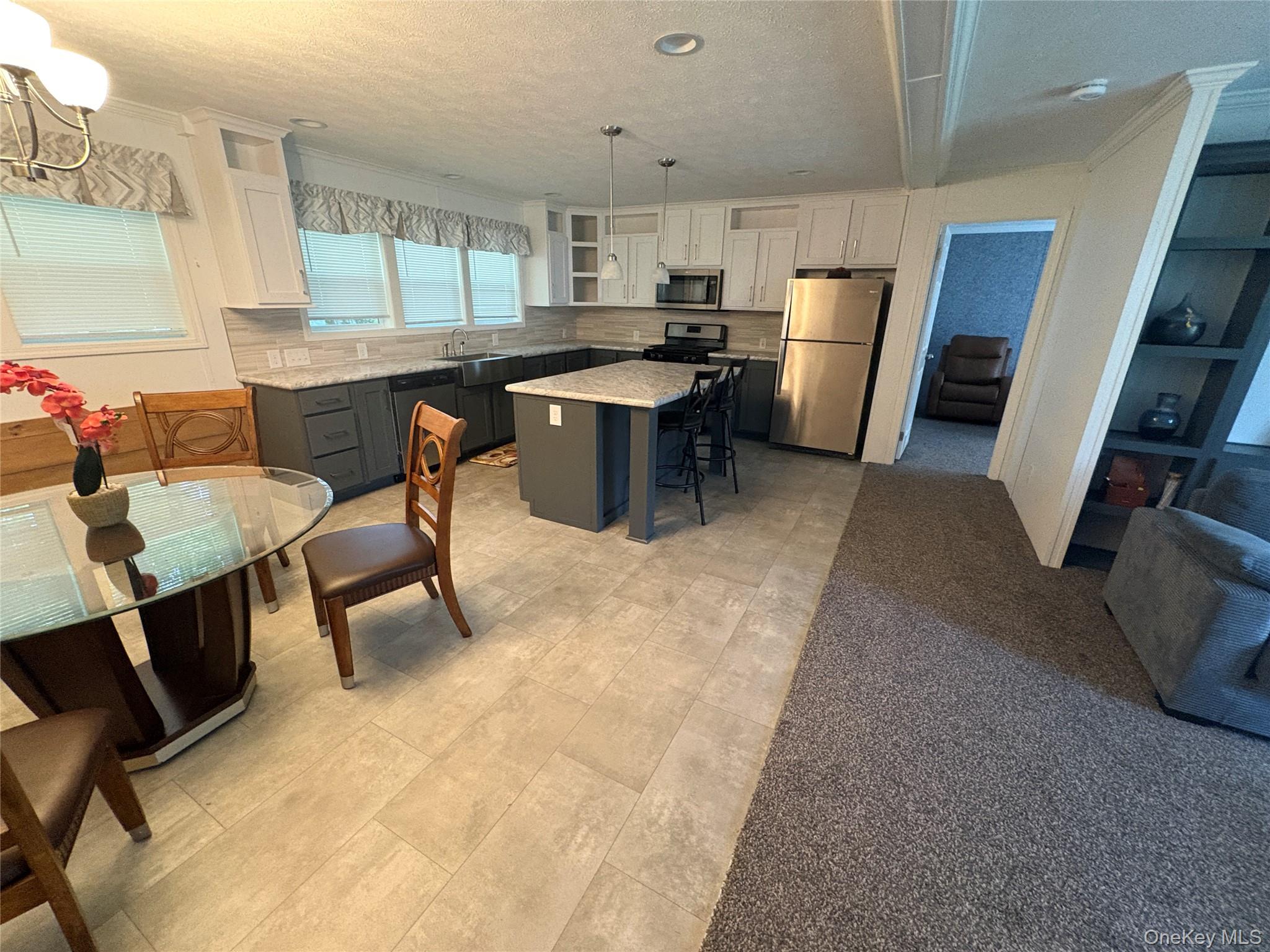 40 4th Street Godeffroy, NY 12729 - Photo 16 of 17 Open-concept living area with modern finishes and furnished seating