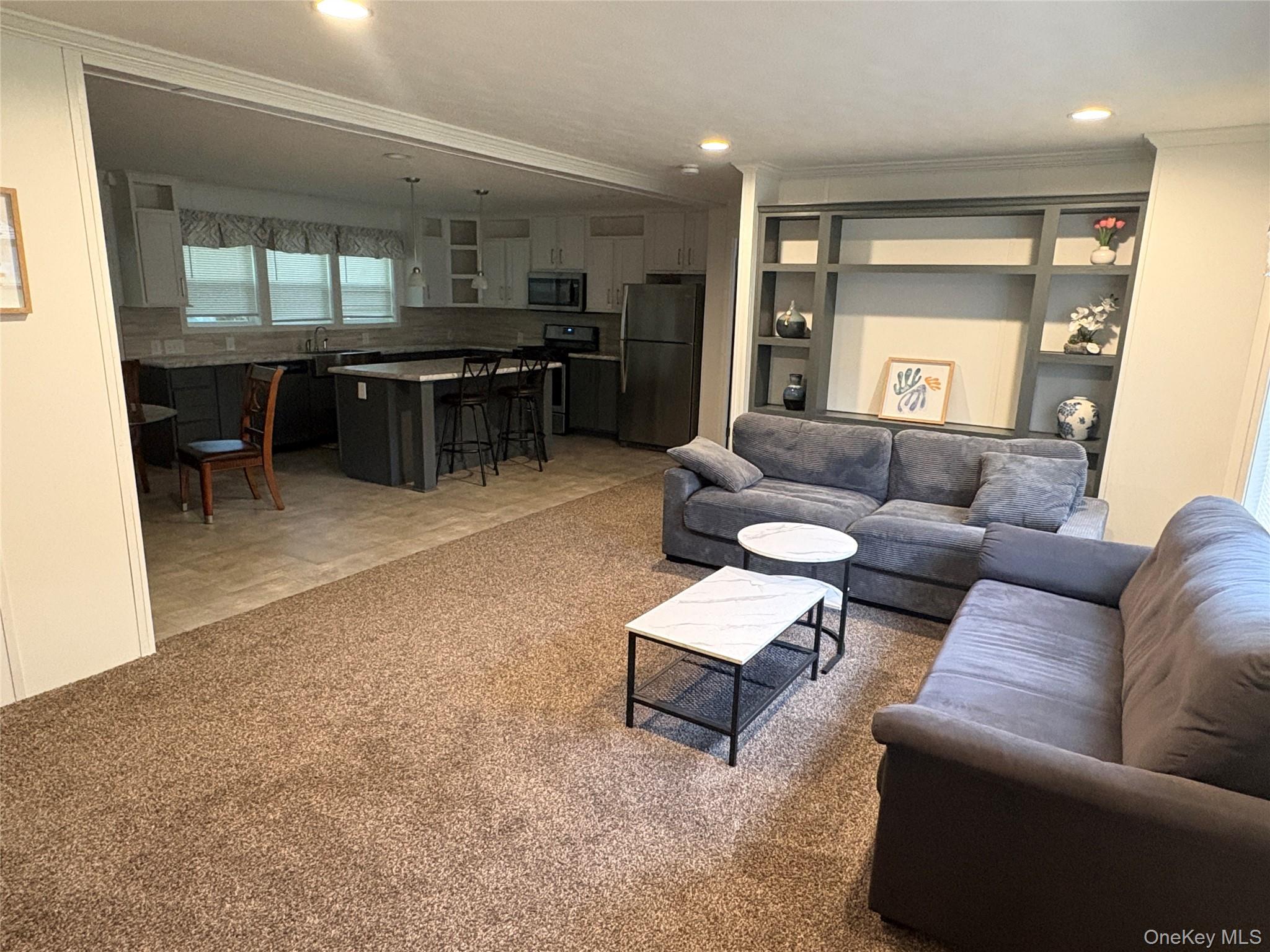 40 4th Street Godeffroy, NY 12729 - Photo 2 of 17 Spacious open-concept living area with abundant natural light.