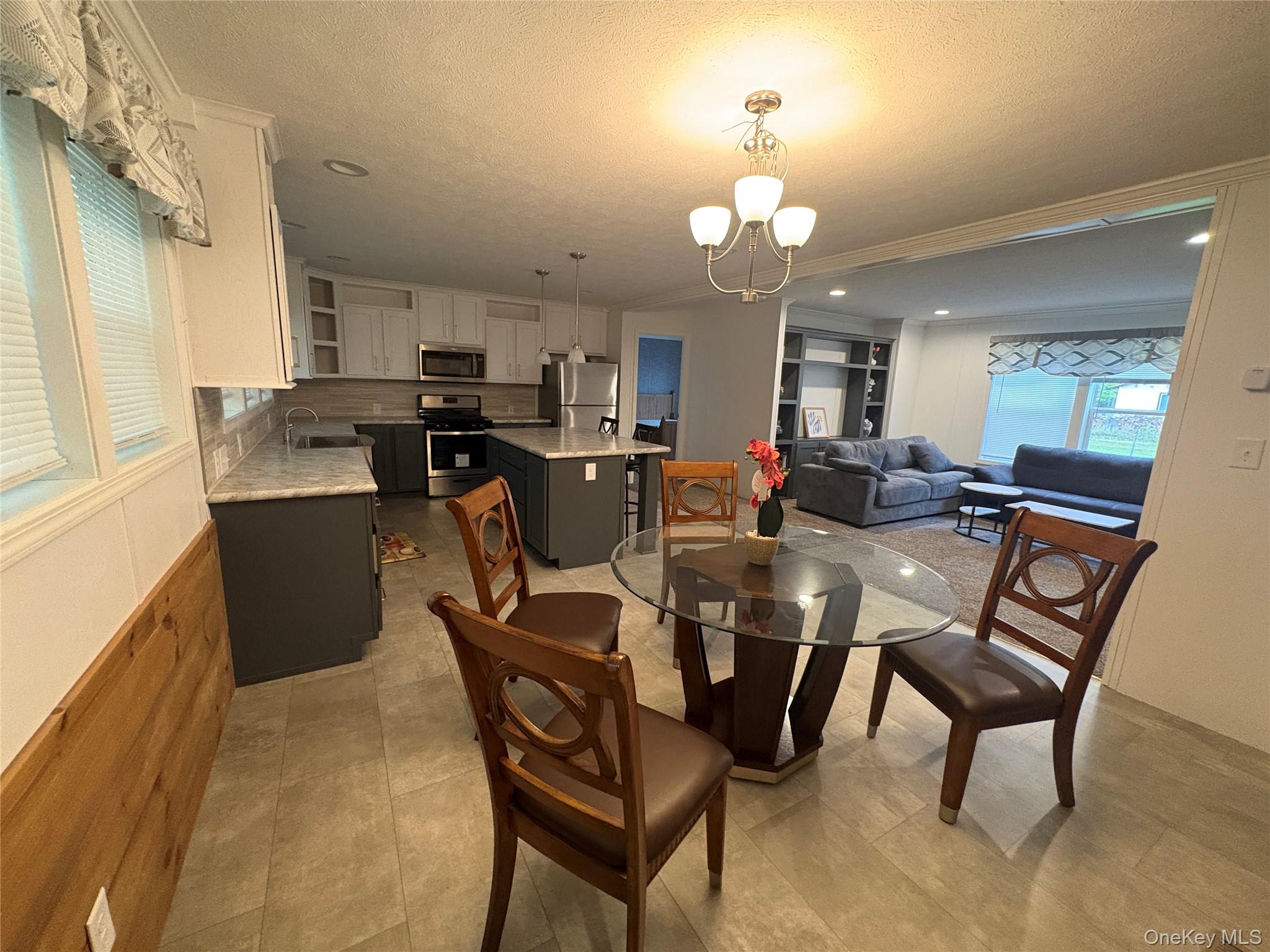 40 4th Street Godeffroy, NY 12729 - Photo 4 of 17 Bright dining area adjacent to kitchen and living room.