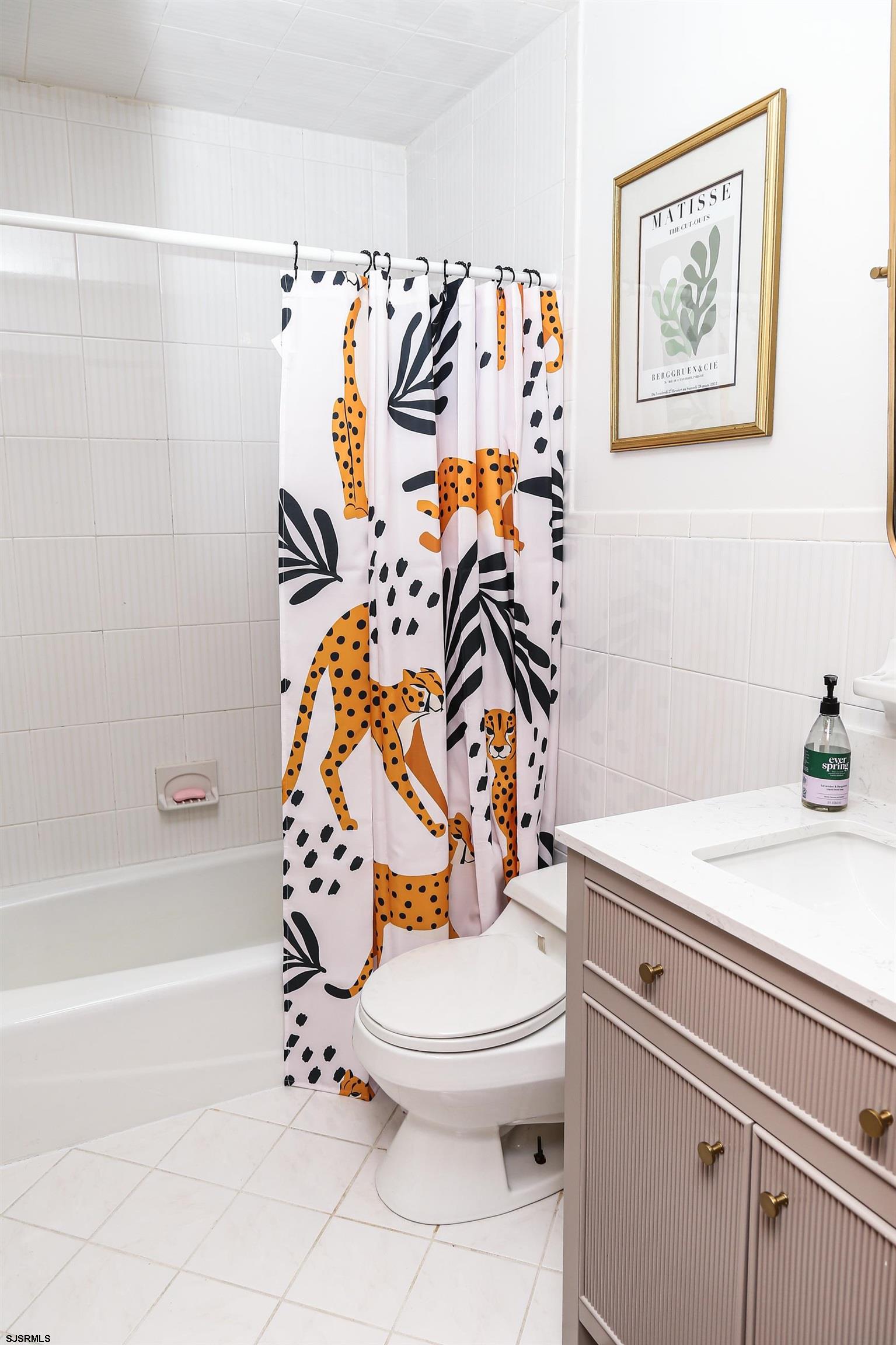 243 6th Street South Brigantine, NJ 08203 - Photo 11 of 28 a bathroom with a toilet and a shower curtain