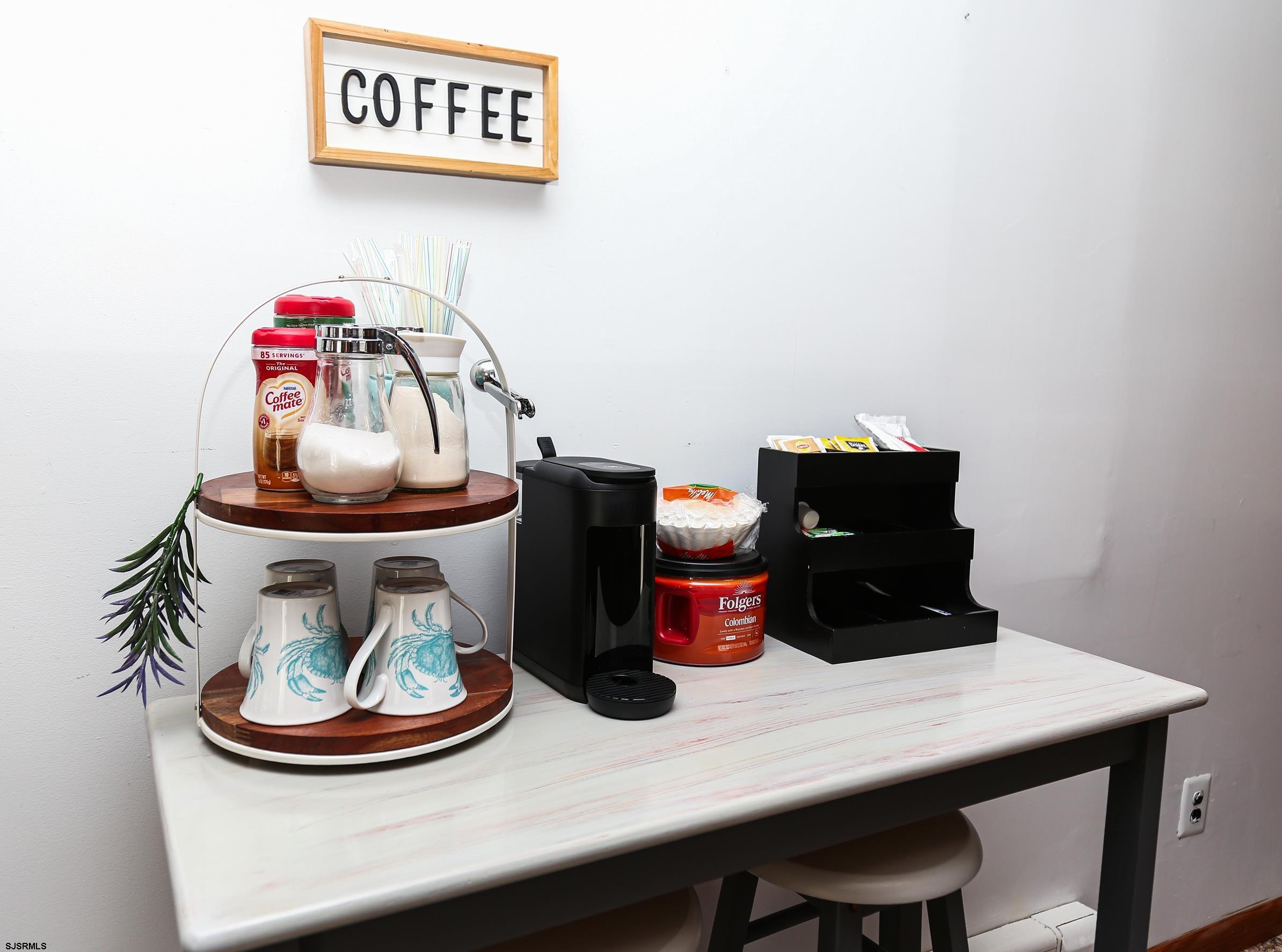 243 6th Street South Brigantine, NJ 08203 - Photo 12 of 28 a view of a dining room with furniture and wooden floor