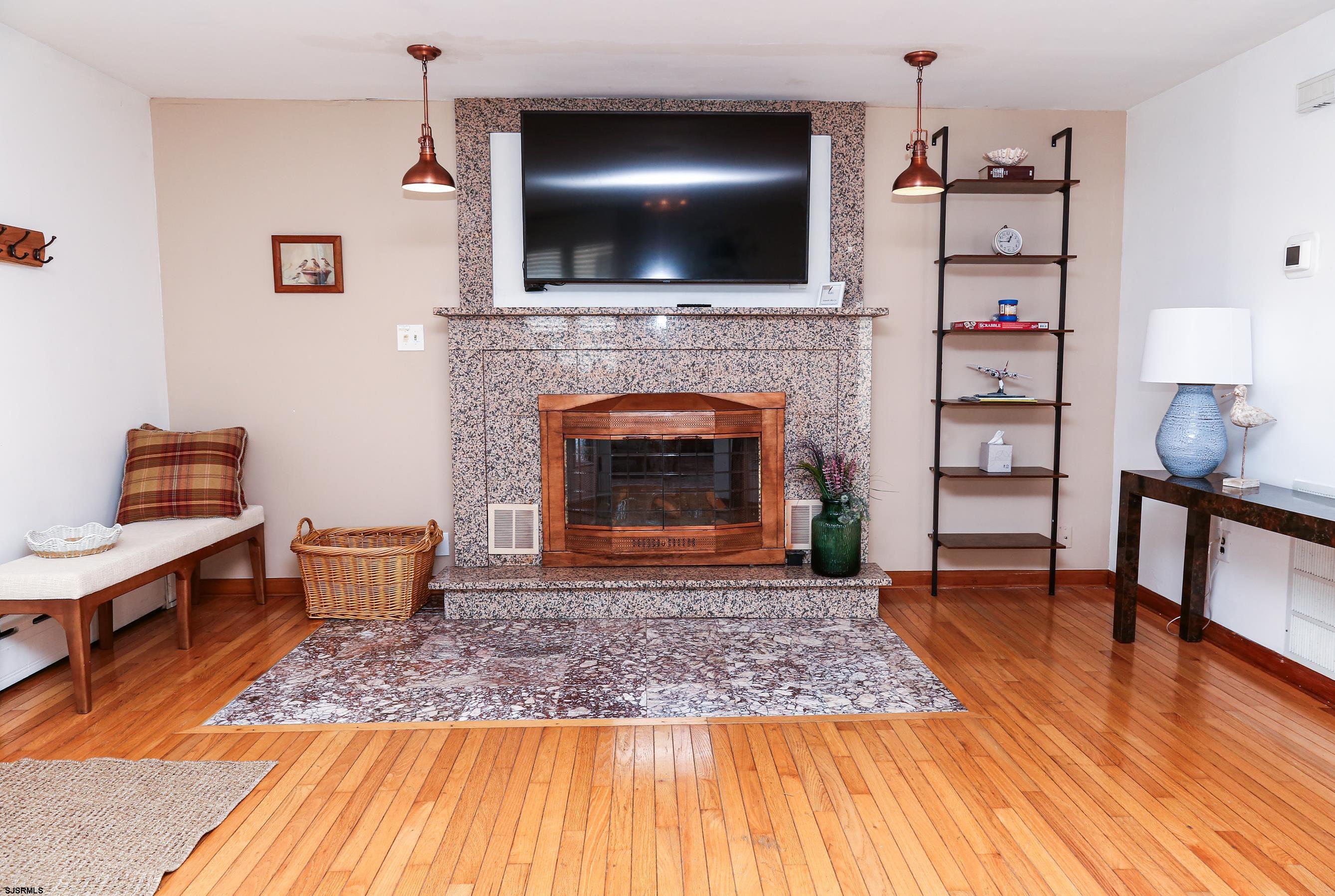 243 6th Street South Brigantine, NJ 08203 - Photo 12 of 28 a living room with furniture and a fireplace