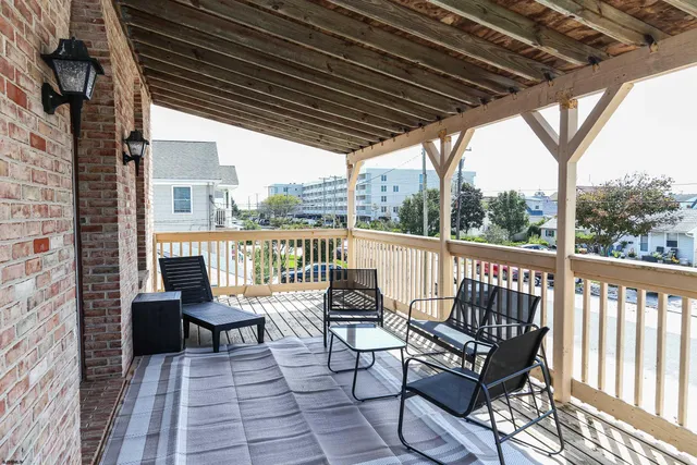 a view of a chairs in wooden deck