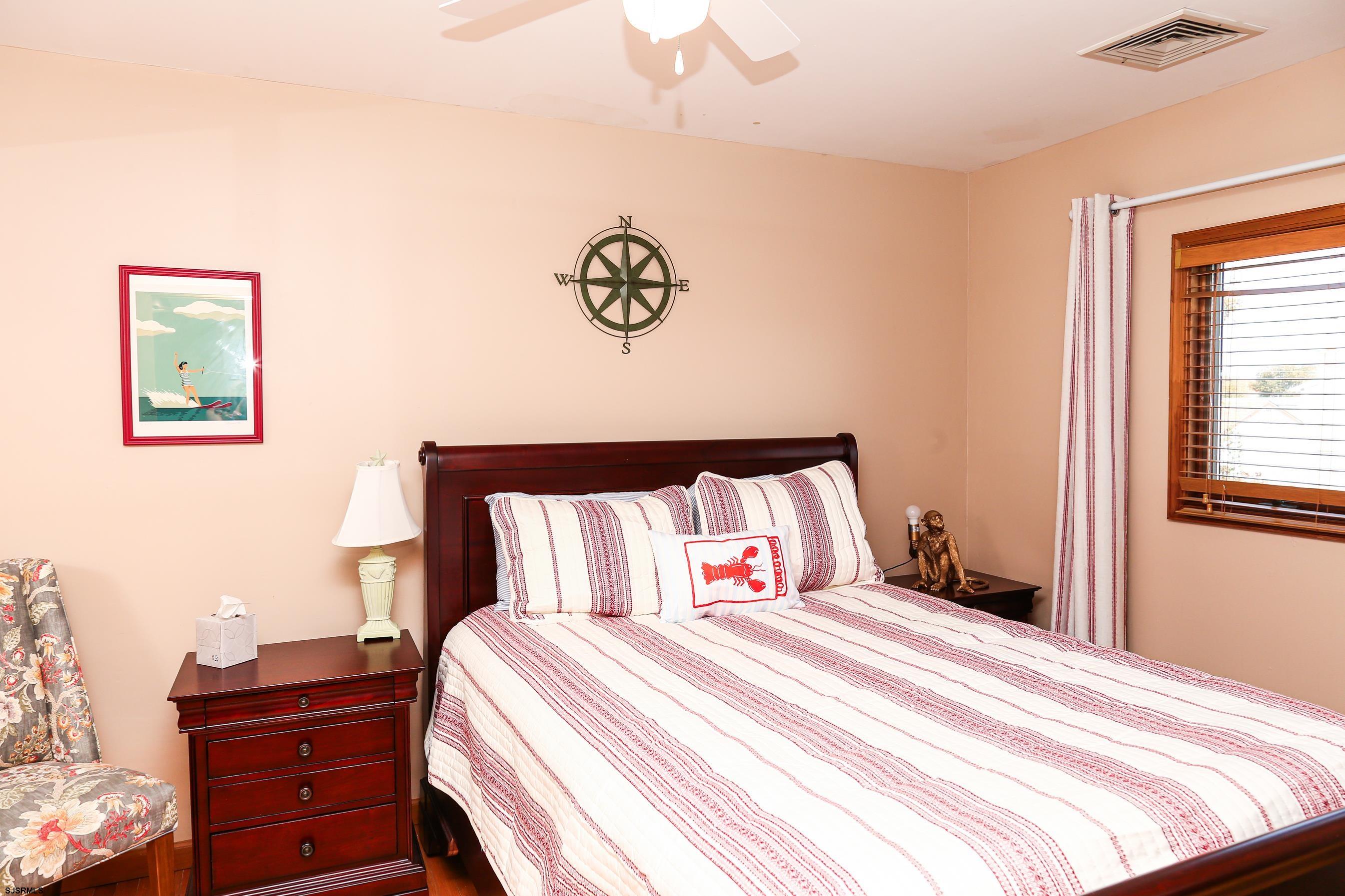 243 6th Street South Brigantine, NJ 08203 - Photo 19 of 28 a bedroom with a bed and a window