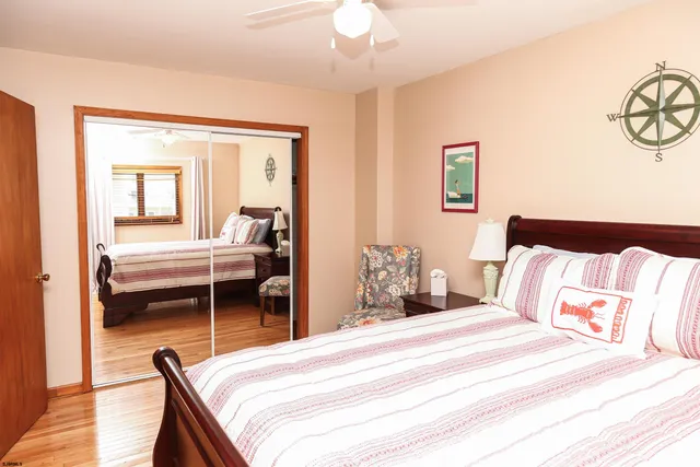 a bedroom with a bed and a dresser