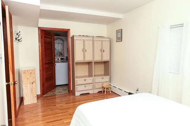 a bedroom with a bed and a desk