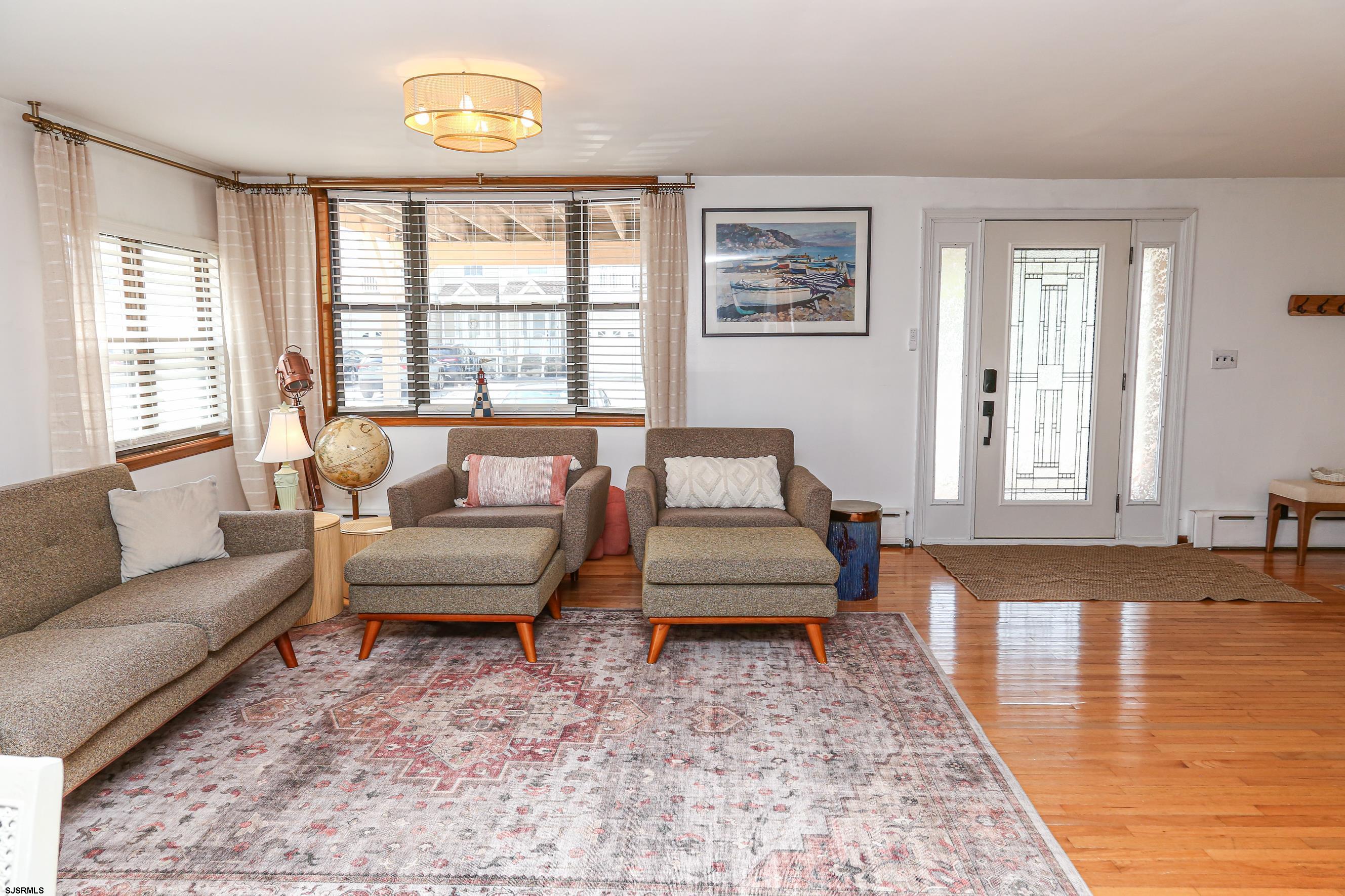 243 6th Street South Brigantine, NJ 08203 - Photo 6 of 28 a living room with furniture and a large window