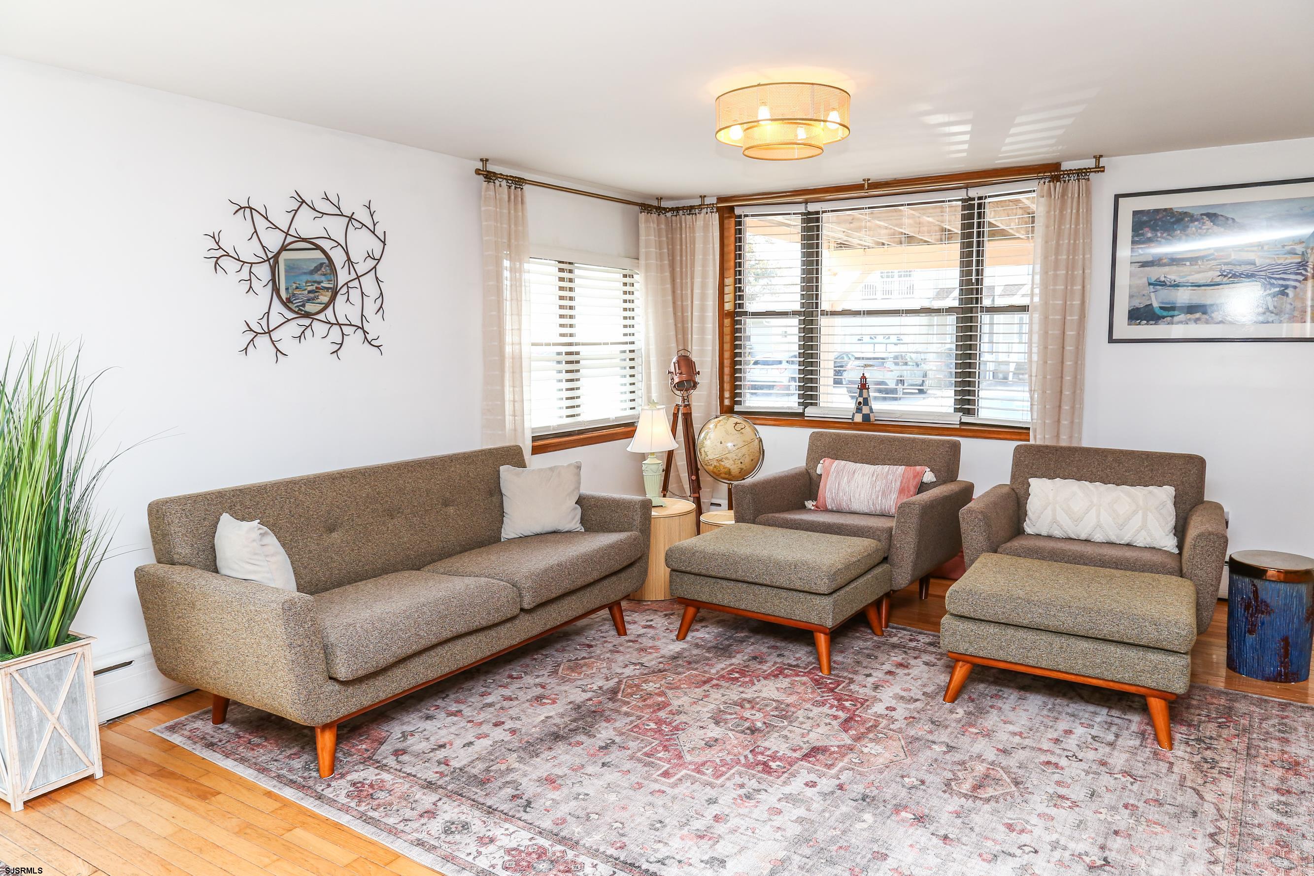 243 6th Street South Brigantine, NJ 08203 - Photo 8 of 28 a living room with furniture and a large window