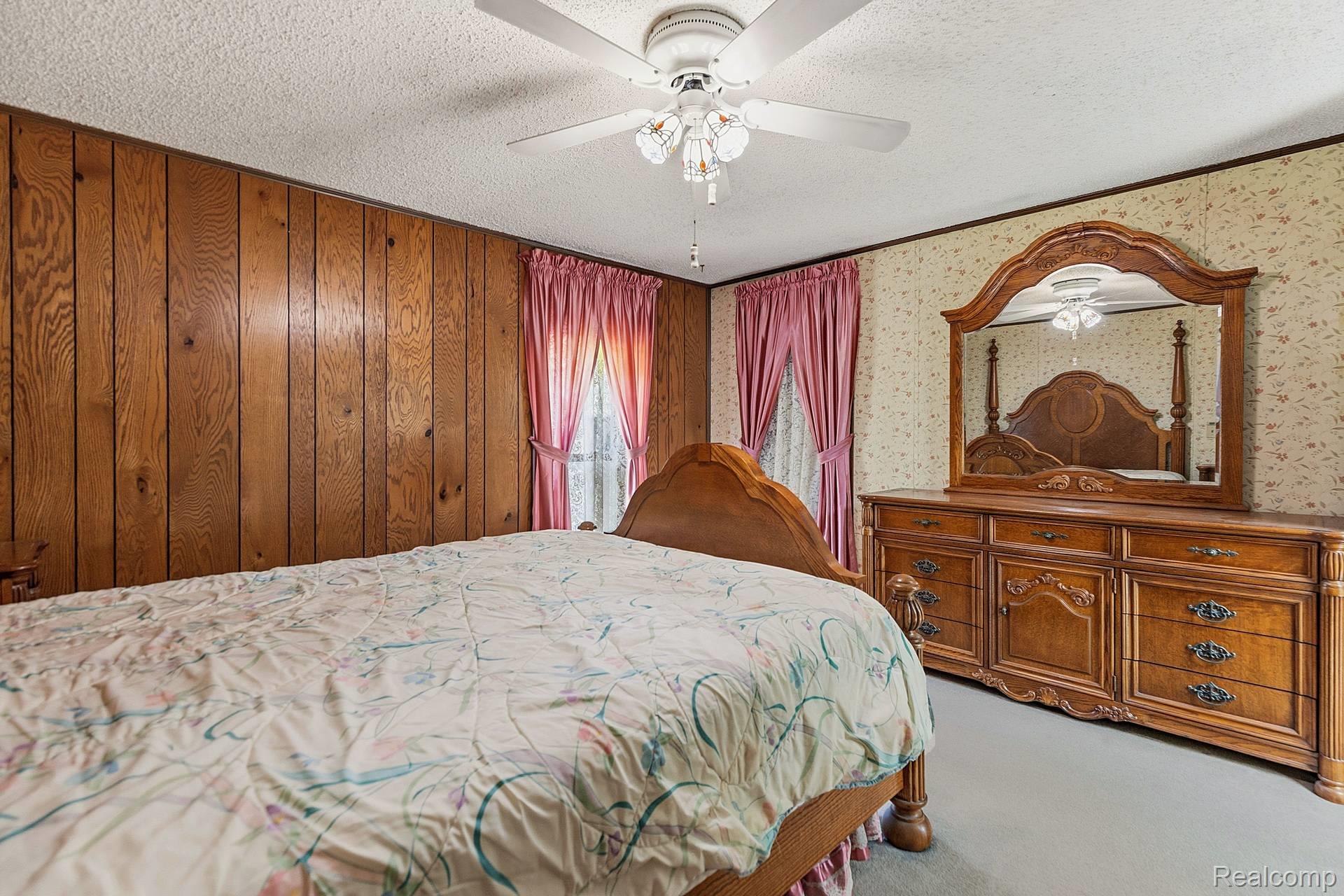70919 Coon Creek Road Armada, MI 48005 - Photo 18 of 50 Bedroom featuring light carpet, a textured ceiling, and ceiling fan