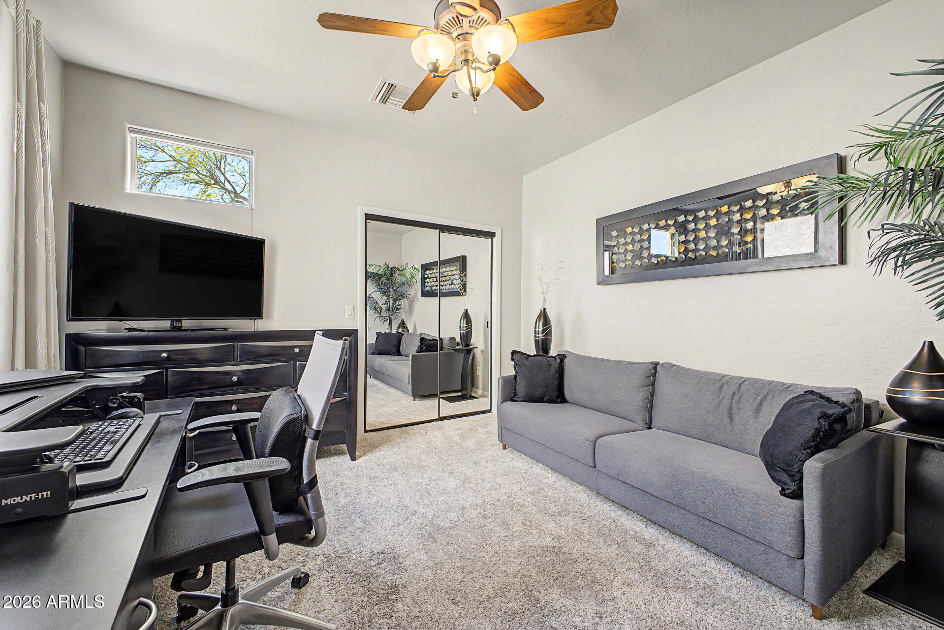 27909 North Quail Spring Road Rio Verde, AZ 85263 - Photo 24 of 52 a living room with furniture and a flat screen tv