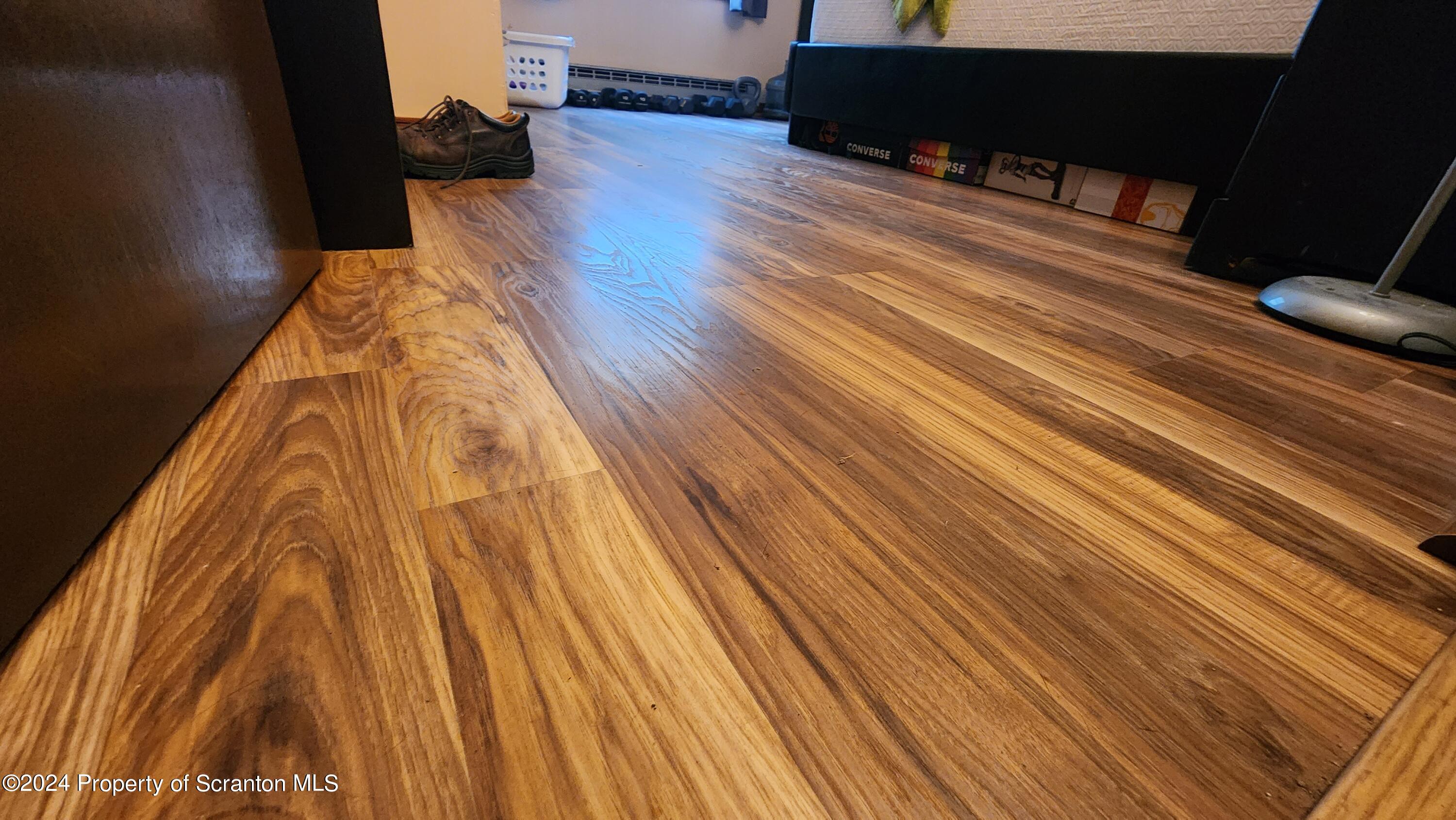 633 Meshopany Ridge Road Meshoppen, PA 18630 - Photo 12 of 41 a living room with wooden floor and furniture