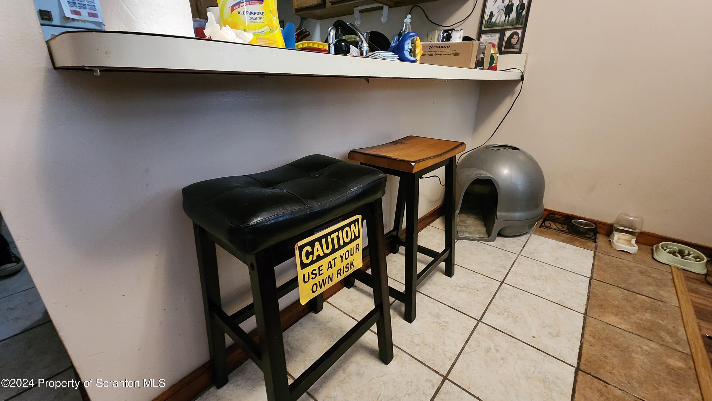 633 Meshopany Ridge Road Meshoppen, PA 18630 - Photo 23 of 41 a bench sitting in a kitchen next to a window