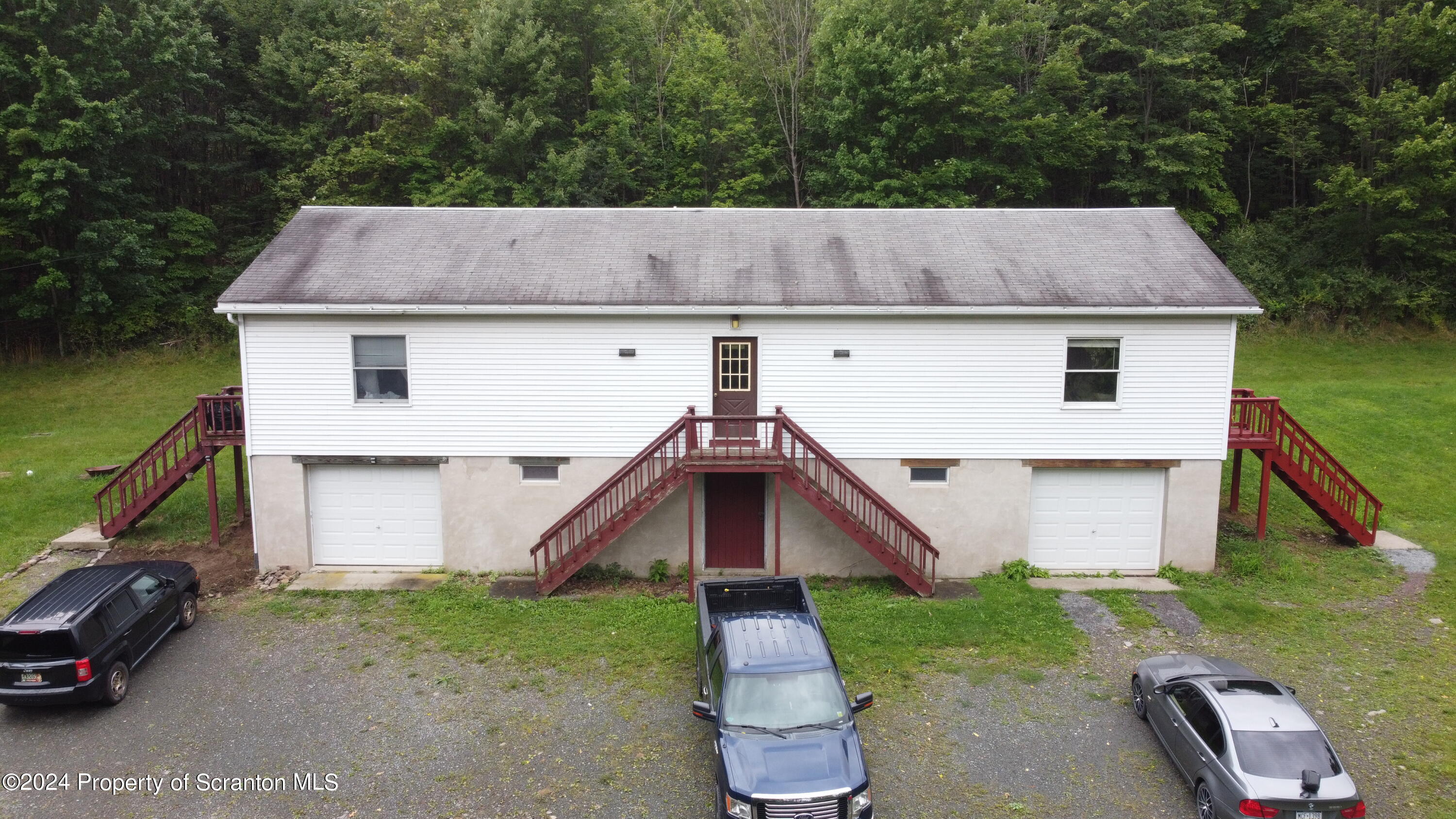633 Meshopany Ridge Road Meshoppen, PA 18630 - Photo 32 of 41 front view of a house with a yard