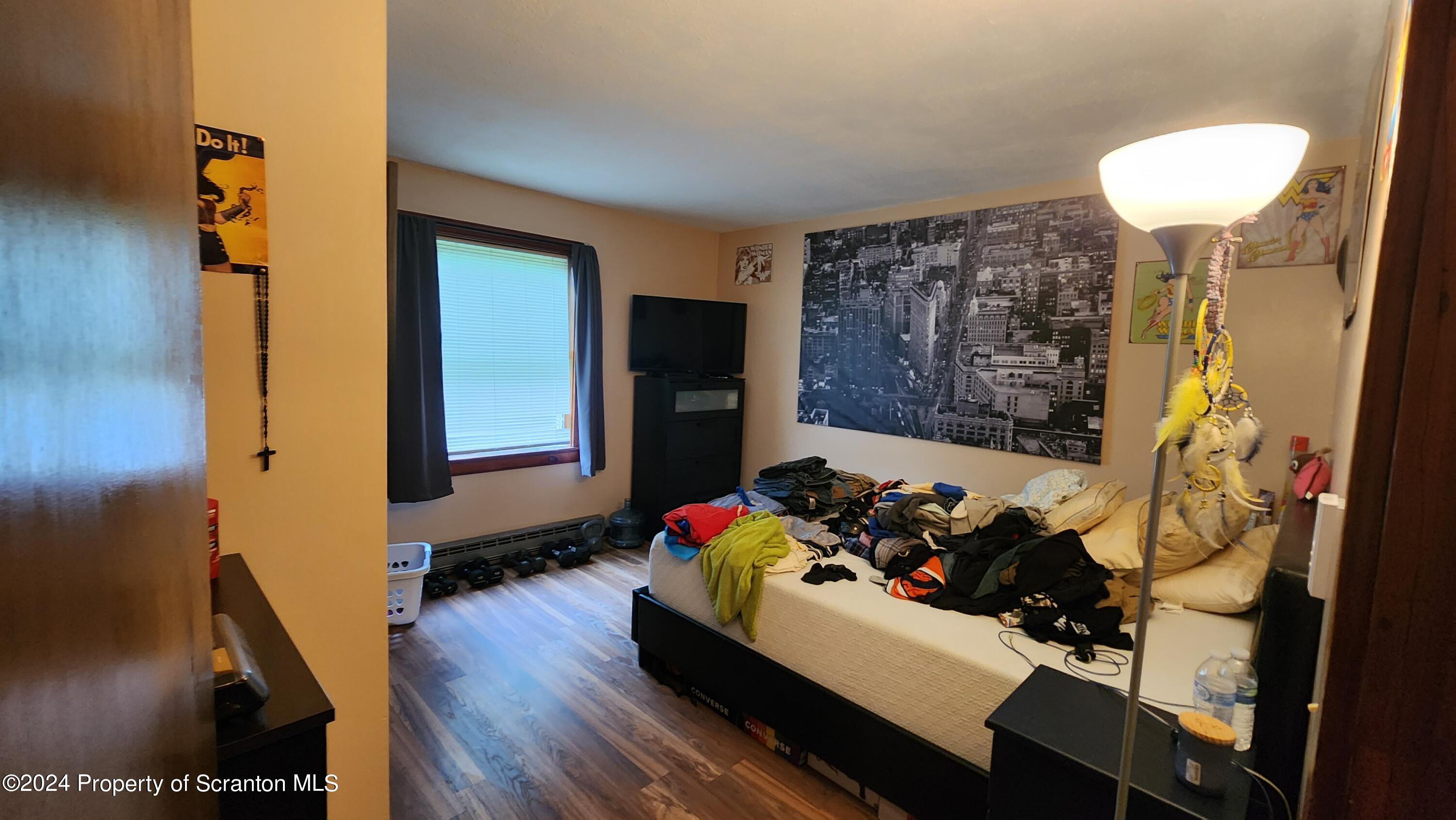 633 Meshopany Ridge Road Meshoppen, PA 18630 - Photo 5 of 41 a room with furniture and a table