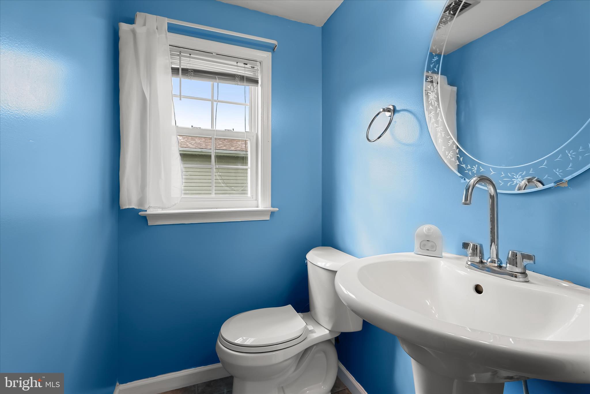 207 Mechanics Valley Road North East, MD 21901 - Photo 18 of 32 a bathroom with a sink a toilet and a mirror