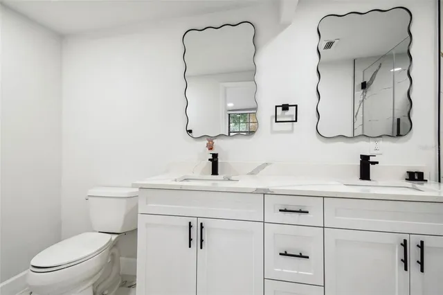 a kitchen with stainless steel appliances a stove microwave and refrigerator