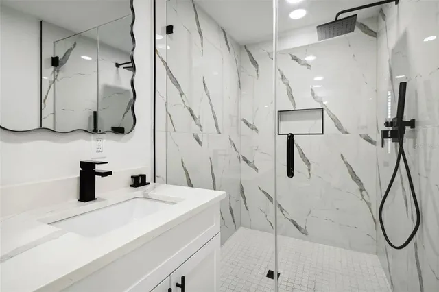 a kitchen with stainless steel appliances a refrigerator and a stove top oven