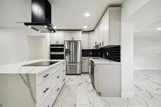 a view of a kitchen with a sink and a window