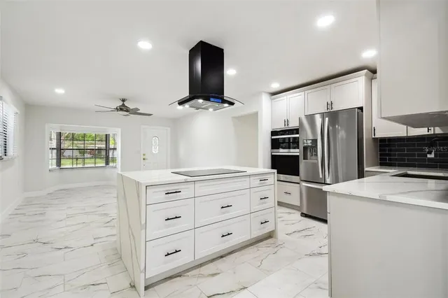 a view of kitchen with microwave and cabinets