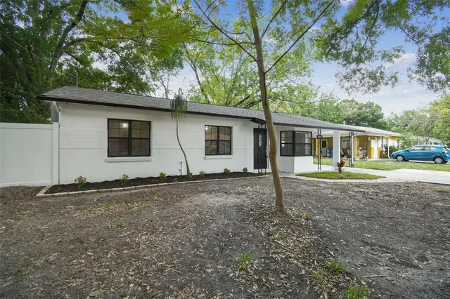 a house with trees in the background