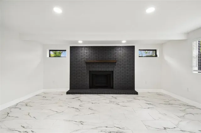 a house that has a tree in front of it