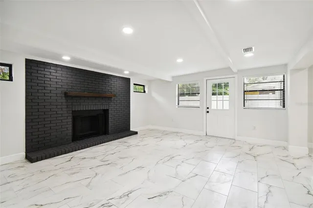 a front view of a house with a yard and a garage