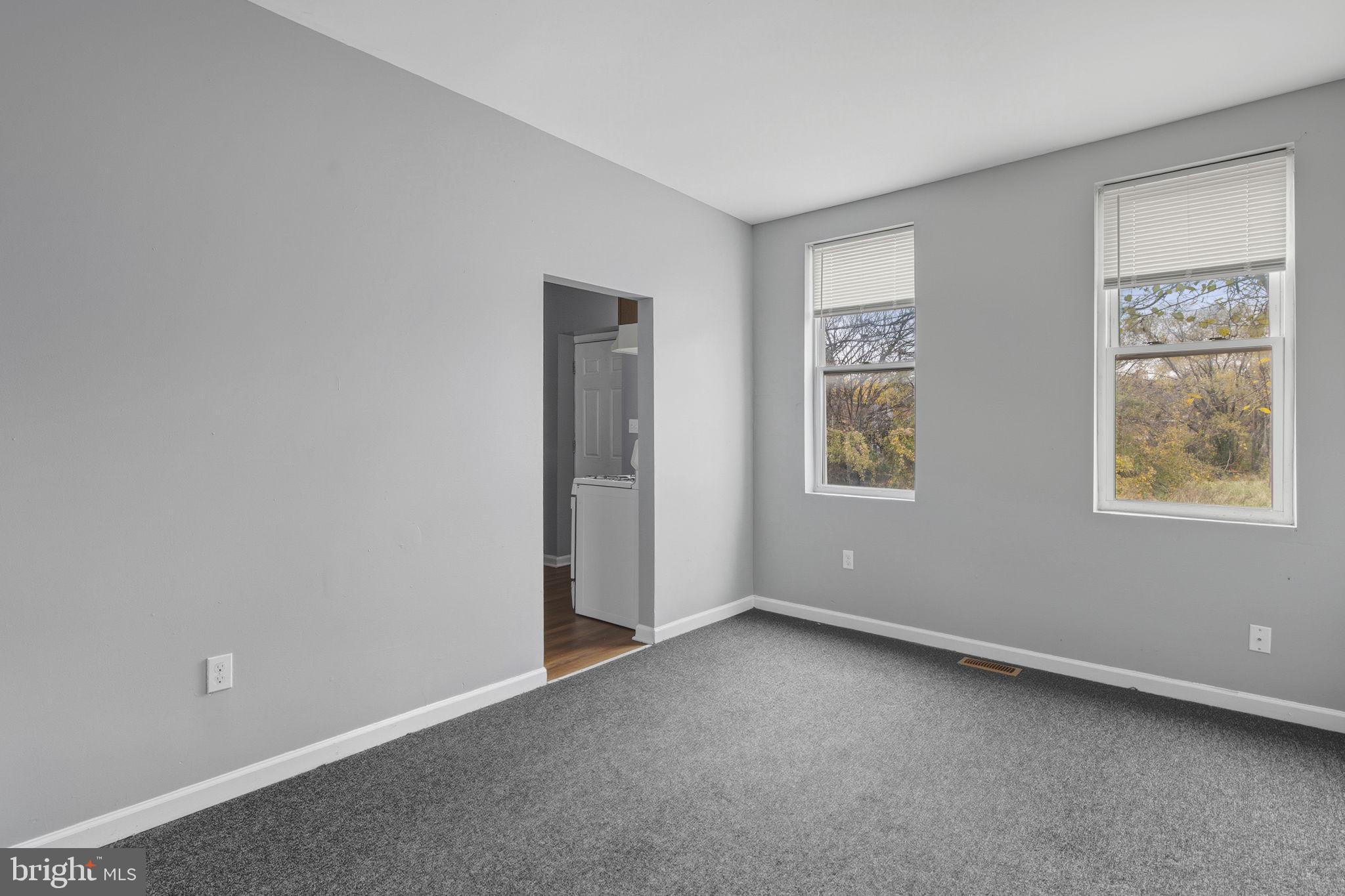 1209 North Dukeland Street Baltimore, MD 21216 - Photo 12 of 21 a view of an empty room with a window
