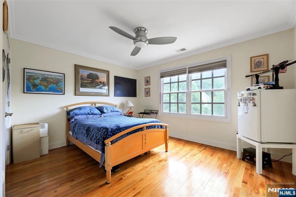 22 Meadowlake Drive Mahwah, NJ 07430 - Photo 27 of 39 a living room with a bed furniture and a window