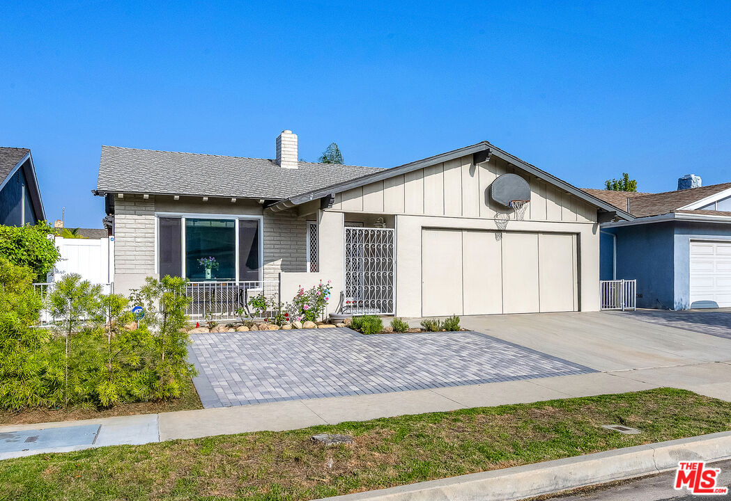 5118 Randall Street Los Angeles, CA 90230 - Photo 1 of 26 a front view of a house with a yard and potted plants