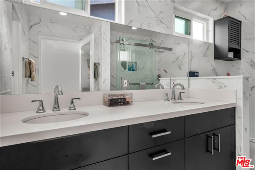 5118 Randall Street Los Angeles, CA 90230 - Photo 15 of 26 a bathroom with a double vanity sink and mirror