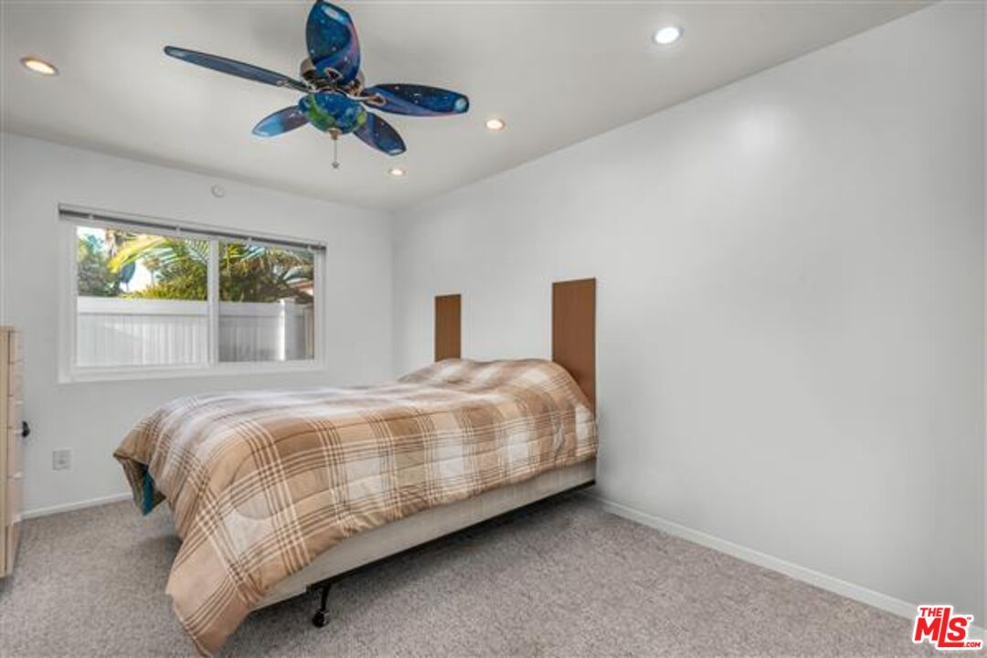 5118 Randall Street Los Angeles, CA 90230 - Photo 17 of 26 a bedroom with a bed and window
