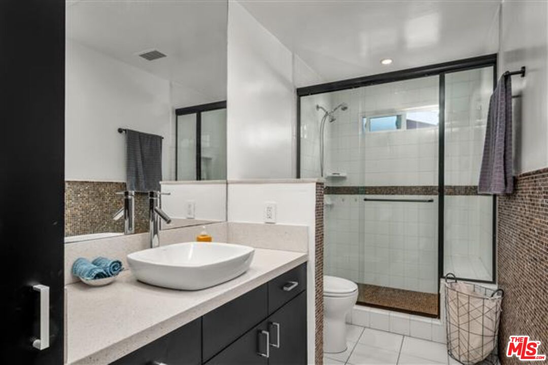 5118 Randall Street Los Angeles, CA 90230 - Photo 18 of 26 a bathroom with a sink and a mirror