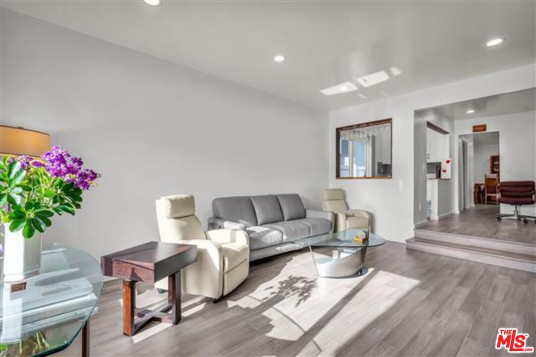 5118 Randall Street Los Angeles, CA 90230 - Photo 3 of 26 a living room with furniture and flowers