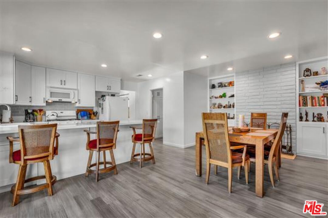 5118 Randall Street Los Angeles, CA 90230 - Photo 8 of 26 a view of a dining room with furniture and wooden floor