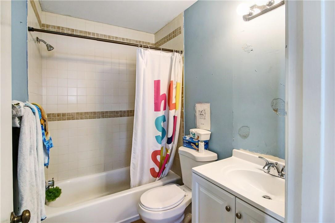 9157 Southwest 5th Street, Unit B Boca Raton, FL 33428 - Photo 16 of 21 a bathroom with a sink toilet and shower