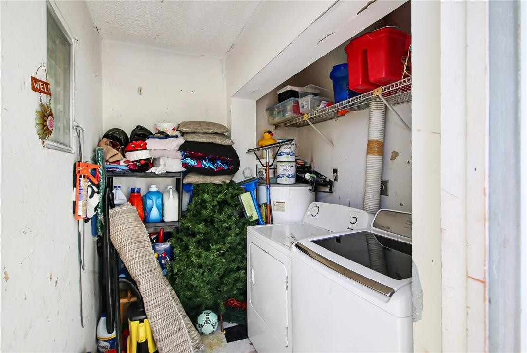 9157 Southwest 5th Street, Unit B Boca Raton, FL 33428 - Photo 18 of 21 a utility room with dryer and washer