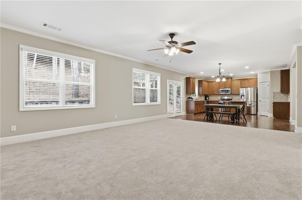 1515 Riva Ridge Suwanee, GA 30024 - Photo 10 of 35 a view of an empty room with a kitchen
