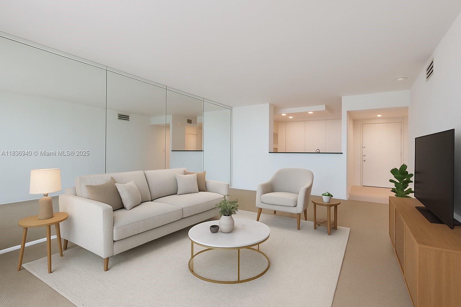 90 Alton Road, Unit 1408 Miami Beach, FL 33139 - Photo 6 of 15 a living room with furniture and a flat screen tv